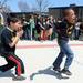 Carpenter Elementary school first graders Sabeeh Shaw and Christian Brown dance to the beat of the Huron High School drumline as they march around the school for a 175th birthday celebration on Friday, April 26, 2013. Melanie Maxwell I AnnArbor.com